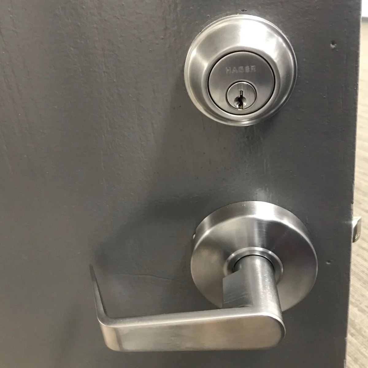Commercial deadbolt and lever handle hardware on a business door in Washington DC