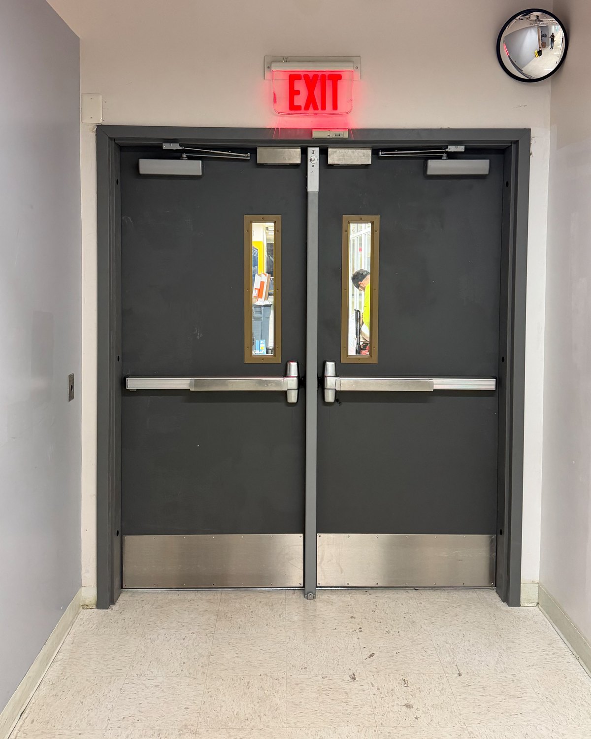 Commercial double exit doors with panic bars, door closers and kick plates