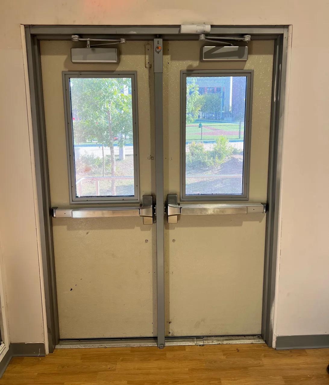 Commercial double exit doors with panic bars and door closers in Washington DC