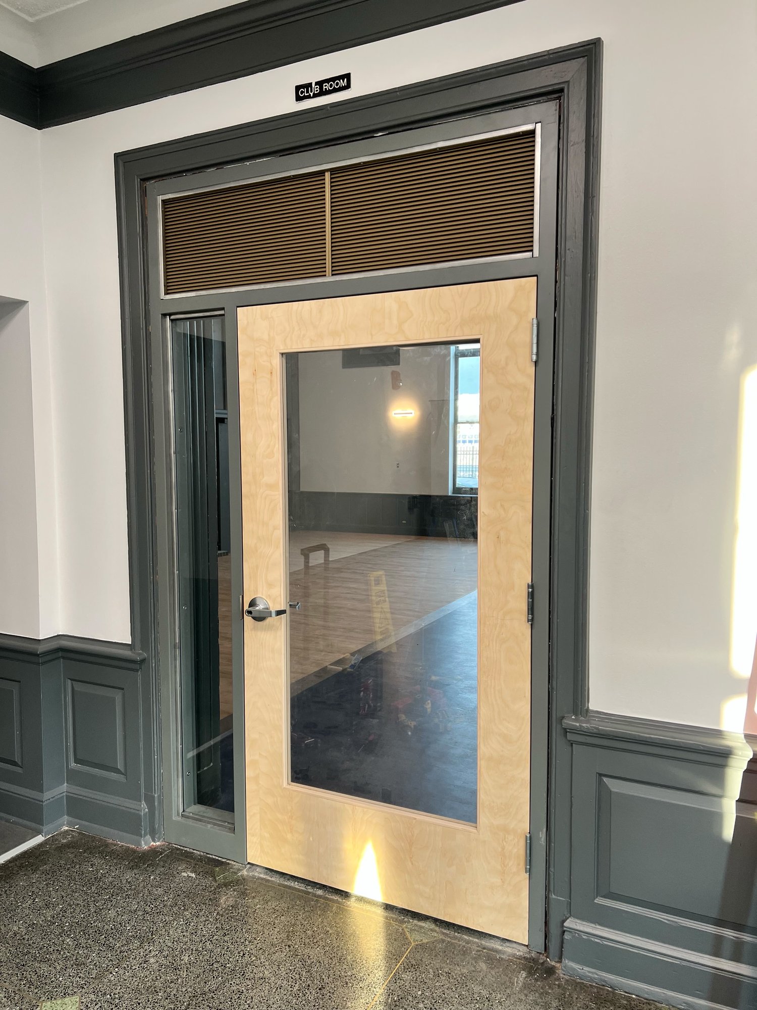 Commercial wood door with full glass lite, sidelight and lever lock